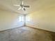 Bedroom with ceiling fan, carpet, and large window at 3811 Desert Marina Dr # 132, Laughlin, NV 89029