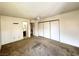 Carpeted bedroom adjacent to bathroom featuring sliding closet doors and a ceiling fan at 3811 Desert Marina Dr # 132, Laughlin, NV 89029