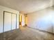 Bedroom with carpet, double door closet and access to bathroom at 3811 Desert Marina Dr # 132, Laughlin, NV 89029