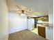 Galley kitchen with wood cabinets and white appliances at 3811 Desert Marina Dr # 132, Laughlin, NV 89029