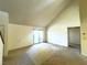 Open living room with high ceilings and door to hallway at 3811 Desert Marina Dr # 132, Laughlin, NV 89029