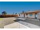 Large backyard with a covered patio and a wooden fence at 4524 Fulton Pl, Las Vegas, NV 89107