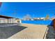 Backyard view with gravel, a blue wall, and covered parking at 4524 Fulton Pl, Las Vegas, NV 89107