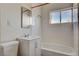 Clean bathroom with white tile and bathtub at 4524 Fulton Pl, Las Vegas, NV 89107