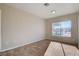 Bright bedroom with tile floors and large window at 4524 Fulton Pl, Las Vegas, NV 89107