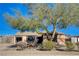 Single-story house with mature tree and well-maintained landscaping at 4524 Fulton Pl, Las Vegas, NV 89107