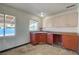 Small kitchen with red cabinets and a corner sink at 4524 Fulton Pl, Las Vegas, NV 89107