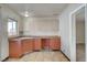 Retro kitchen with orange cabinets and tile floor at 4524 Fulton Pl, Las Vegas, NV 89107