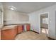 Retro kitchen with orange cabinets and tile floor at 4524 Fulton Pl, Las Vegas, NV 89107