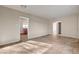 Spacious living room with tile floors and access to other rooms at 4524 Fulton Pl, Las Vegas, NV 89107