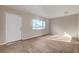 Bright living room with tile floors and a view of the front door at 4524 Fulton Pl, Las Vegas, NV 89107