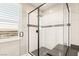 Bathroom featuring a walk-in shower with modern tile and fixtures at 49 Vista Outlook St, Henderson, NV 89011