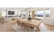 Light and airy dining room with wood table at 49 Vista Outlook St, Henderson, NV 89011