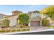 Modern two-story home with attached garage and desert landscaping at 49 Vista Outlook St, Henderson, NV 89011