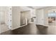 Home hallway with dark wood flooring and access to bedrooms at 49 Vista Outlook St, Henderson, NV 89011