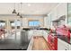 Modern kitchen with island, red stove and city views at 49 Vista Outlook St, Henderson, NV 89011