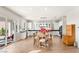 Kitchen with white cabinets, island, and breakfast nook at 49 Vista Outlook St, Henderson, NV 89011