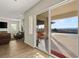 Living room with sliding glass doors leading to a patio with scenic view at 49 Vista Outlook St, Henderson, NV 89011