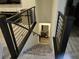 Modern staircase leading downstairs with metal railings at 5773 Holbeche St, Las Vegas, NV 89113