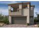 Two-story home with balcony and attached garage at 583 Preston Oak, Las Vegas, NV 89138