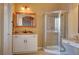 Bathroom boasts granite vanity, large mirror and corner shower at 5908 Aqua Verde St, North Las Vegas, NV 89031