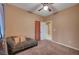 Cozy bedroom with a daybed, carpet, and ceiling fan at 5908 Aqua Verde St, North Las Vegas, NV 89031