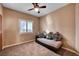 Bedroom with a daybed and decorative pillows, ceiling fan at 5908 Aqua Verde St, North Las Vegas, NV 89031