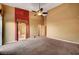 Large bedroom featuring an accent wall and access to bathroom and closets at 5908 Aqua Verde St, North Las Vegas, NV 89031