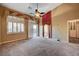 Bright bedroom with ensuite bathroom access and ceiling fan at 5908 Aqua Verde St, North Las Vegas, NV 89031