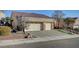 Single-story house with three-car garage and desert landscaping at 5908 Aqua Verde St, North Las Vegas, NV 89031