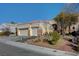 Single story house with a three-car garage and nicely landscaped yard at 5908 Aqua Verde St, North Las Vegas, NV 89031