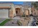 House exterior with a three-car garage and walkway to the front door at 5908 Aqua Verde St, North Las Vegas, NV 89031