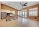 Open kitchen with island, stainless steel appliances, and tiled floor at 5908 Aqua Verde St, North Las Vegas, NV 89031