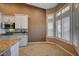 Bright kitchen with granite countertops and white cabinets at 5908 Aqua Verde St, North Las Vegas, NV 89031