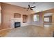 Living room with a fireplace and built-in entertainment center at 5908 Aqua Verde St, North Las Vegas, NV 89031