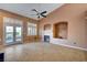 Living room with tile floors, fireplace, and access to backyard at 5908 Aqua Verde St, North Las Vegas, NV 89031