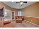 Bright office with ceiling fan, built-in shelving, and French doors at 5908 Aqua Verde St, North Las Vegas, NV 89031