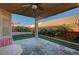 Covered patio with stone tile flooring and backyard view at 5908 Aqua Verde St, North Las Vegas, NV 89031