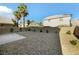 Sunny backyard with gravel and patio at 5912 Royal Castle Ln, Las Vegas, NV 89130