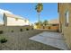 Landscaped backyard with patio and gravel at 5912 Royal Castle Ln, Las Vegas, NV 89130