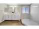 Elegant bathroom with double vanity and walk-in shower at 5912 Royal Castle Ln, Las Vegas, NV 89130