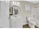 Updated bathroom with white vanity, bathtub and toilet at 5912 Royal Castle Ln, Las Vegas, NV 89130