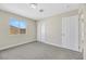 Spacious bedroom with grey carpet, neutral walls, and a closet at 5912 Royal Castle Ln, Las Vegas, NV 89130