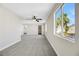 Spacious main bedroom with ceiling fan, large windows, and ensuite bathroom at 5912 Royal Castle Ln, Las Vegas, NV 89130