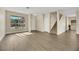 Bright living room featuring hardwood floors and a staircase at 5912 Royal Castle Ln, Las Vegas, NV 89130