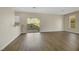 Spacious living room with vinyl flooring and sliding glass door to backyard at 5912 Royal Castle Ln, Las Vegas, NV 89130