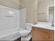 Clean bathroom featuring a tub with shower, toilet, and wood vanity with sink at 5915 Nuevo Leon St # 7, North Las Vegas, NV 89031