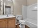 Well-lit bathroom with updated vanity, toilet, and shower-tub combination at 5915 Nuevo Leon St # 7, North Las Vegas, NV 89031