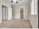 Serene bedroom with neutral carpet, ample closet space, and natural light at 5915 Nuevo Leon St # 7, North Las Vegas, NV 89031