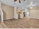 Open-concept condo living room featuring modern flooring and staircase at 5915 Nuevo Leon St # 7, North Las Vegas, NV 89031